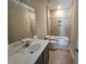 Modern bathroom features granite countertop, an undermount sink, tiled floors, and tiled shower at 2595 Wise River Ln, Zephyrhills, FL 33541