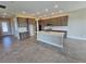 Spacious kitchen featuring a central island, stainless steel appliances, and ample cabinet space at 2595 Wise River Ln, Zephyrhills, FL 33541