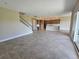 Open-concept living room seamlessly transitions into the kitchen, perfect for modern living and entertaining at 2595 Wise River Ln, Zephyrhills, FL 33541