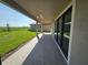 This covered patio features views of the spacious backyard at 2595 Wise River Ln, Zephyrhills, FL 33541