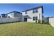 Expansive grassy backyard offering plenty of space for relaxation and outdoor entertainment possibilities at 30226 Merilee Pl, Wesley Chapel, FL 33545
