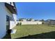 Expansive backyard featuring lush green lawn and a wooden playset, perfect for outdoor activities and relaxation at 30226 Merilee Pl, Wesley Chapel, FL 33545
