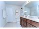 Bathroom with double sink vanity, modern fixtures, and a clean, neutral color scheme at 30226 Merilee Pl, Wesley Chapel, FL 33545