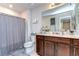 Well-lit bathroom offers vanity, toilet, tub, and functional design at 30226 Merilee Pl, Wesley Chapel, FL 33545