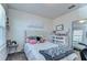 Serene bedroom boasts decor, comfy bed, bright ambiance, and carpeted floors at 30226 Merilee Pl, Wesley Chapel, FL 33545