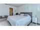 Cozy bedroom with a large bed, plush seating, and stylish decor elements at 30226 Merilee Pl, Wesley Chapel, FL 33545