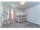Bright bedroom features a bunk bed and neutral decor at 30226 Merilee Pl, Wesley Chapel, FL 33545