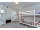 Bright bedroom features a bunk bed, tv and neutral decor at 30226 Merilee Pl, Wesley Chapel, FL 33545