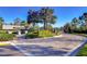 Wesbridge community entrance with lush landscaping and elegant stone signage at 30226 Merilee Pl, Wesley Chapel, FL 33545