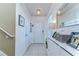 Bright foyer featuring tile flooring, modern lighting, and stylish decor at 30226 Merilee Pl, Wesley Chapel, FL 33545