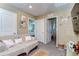 Hallway with access to multiple rooms, neutral walls, and cozy decor elements at 30226 Merilee Pl, Wesley Chapel, FL 33545