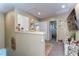 Bright hallway features neutral walls and decor with view to several rooms at 30226 Merilee Pl, Wesley Chapel, FL 33545