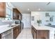 Spacious kitchen featuring stainless steel appliances, quartz countertops, and ample cabinet storage at 30226 Merilee Pl, Wesley Chapel, FL 33545