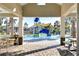 Water park with a water slide and covered seating areas, perfect for Gathering fun in the community pool area at 30226 Merilee Pl, Wesley Chapel, FL 33545