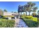 Charming entrance sign for Wesbridge community, set among lush greenery and picturesque stone pathway at 30226 Merilee Pl, Wesley Chapel, FL 33545