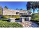 Welcoming entrance sign for Wesbridge, beautifully landscaped with stone accents and lush greenery at 30226 Merilee Pl, Wesley Chapel, FL 33545