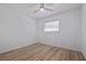 Bright bedroom with ceiling fan, hardwood floors, and white walls, plus a window for natural light at 311 W Fern St, Tampa, FL 33604