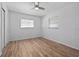 A bedroom with a ceiling fan, wood floors and a double door closet at 311 W Fern St, Tampa, FL 33604