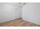 Bright bedroom with hardwood floors, white walls, plus a closet and window for natural light at 311 W Fern St, Tampa, FL 33604