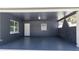 Spacious carport with block wall and matching blue paint for shade and protection at 311 W Fern St, Tampa, FL 33604