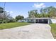 Ranch-style home with a well-manicured lawn and a long driveway for easy parking at 311 W Fern St, Tampa, FL 33604