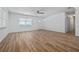 The spacious living area offers clean, white interiors with attractive wood flooring at 311 W Fern St, Tampa, FL 33604