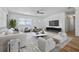 Bright living room features a ceiling fan, modern furniture, and luxury decor at 311 W Fern St, Tampa, FL 33604