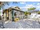 Spacious back deck for entertaining with a screened-in porch and white picket fence at 322 11Th N Ave, St Petersburg, FL 33701