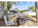 Spacious backyard with a fire pit, deck, and a well-maintained lawn at 322 11Th N Ave, St Petersburg, FL 33701