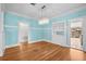 Dining area with hardwood floors, a crystal chandelier, and built-in cabinets at 322 11Th N Ave, St Petersburg, FL 33701