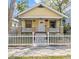 Charming home with a white picket fence, inviting front porch, and colorful landscaping at 322 11Th N Ave, St Petersburg, FL 33701
