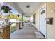 Inviting front porch with swing, hanging plants, and space to relax at 322 11Th N Ave, St Petersburg, FL 33701