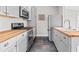 Galley kitchen featuring tile floors, butcher block countertops, stainless steel appliances, and gray cabinets at 322 11Th N Ave, St Petersburg, FL 33701