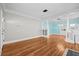 Spacious living room with hardwood floors, built-in shelving, and open layout at 322 11Th N Ave, St Petersburg, FL 33701
