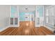 Spacious living room with hardwood floors, built-in cabinets, and bright blue walls at 322 11Th N Ave, St Petersburg, FL 33701