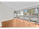 Sunroom with wood floors, large windows, and views of the back deck at 322 11Th N Ave, St Petersburg, FL 33701