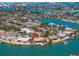 Waterfront property with lush landscaping and private dock at 351 S Julia Cir, St Pete Beach, FL 33706