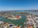 Stunning aerial view of waterfront home in a coastal community with boat docks and access to the bay at 351 S Julia Cir, St Pete Beach, FL 33706