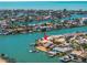 Aerial view showcases the coastal community surrounding the waterfront property with docks and lush landscaping at 351 S Julia Cir, St Pete Beach, FL 33706