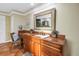 Bathroom includes a wood vanity with granite countertops, a large mirror, and terracotta tiled floors at 351 S Julia Cir, St Pete Beach, FL 33706