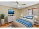 Stylish bedroom with ceiling fan, soft lighting, and comfortable decor at 351 S Julia Cir, St Pete Beach, FL 33706