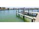 Well-maintained dock with boat lift, perfect for boating and waterfront living at 351 S Julia Cir, St Pete Beach, FL 33706