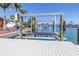 Modern boat lift on a canal, providing convenient boat storage and access at 351 S Julia Cir, St Pete Beach, FL 33706