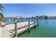 Well-maintained dock with boat lift offering direct access to the waterway at 351 S Julia Cir, St Pete Beach, FL 33706