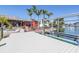 Private boat dock with lift, offering convenient access to the water for boating and water activities at 351 S Julia Cir, St Pete Beach, FL 33706