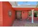 Inviting front entrance with a decorative door, terracotta tiles and a sunburst accent at 351 S Julia Cir, St Pete Beach, FL 33706