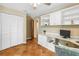 Comfortable home office setup featuring built-in storage and natural light at 351 S Julia Cir, St Pete Beach, FL 33706