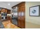 Gourmet kitchen features stainless steel appliances, custom cabinets, and beautiful terra cotta tile flooring at 351 S Julia Cir, St Pete Beach, FL 33706