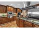 This kitchen features custom cabinets, granite countertops, stainless steel appliances and center island at 351 S Julia Cir, St Pete Beach, FL 33706