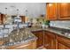 Spacious kitchen has an island with bar seating and leads into the living room, perfect for entertaining at 351 S Julia Cir, St Pete Beach, FL 33706